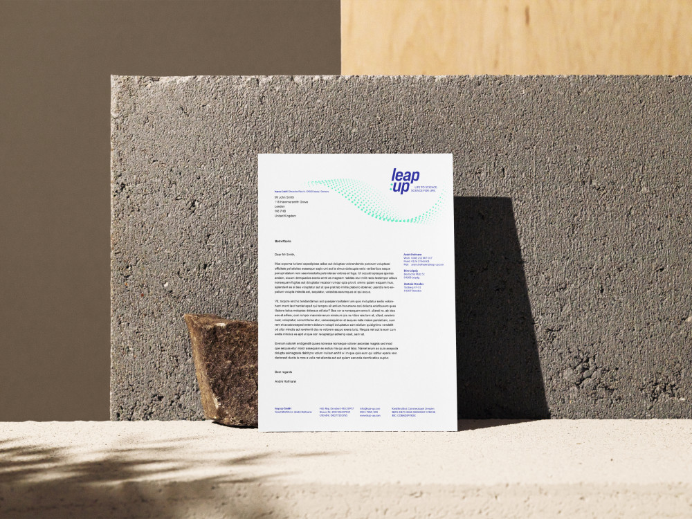 Letter paper in the new leap:up design on a stone wall