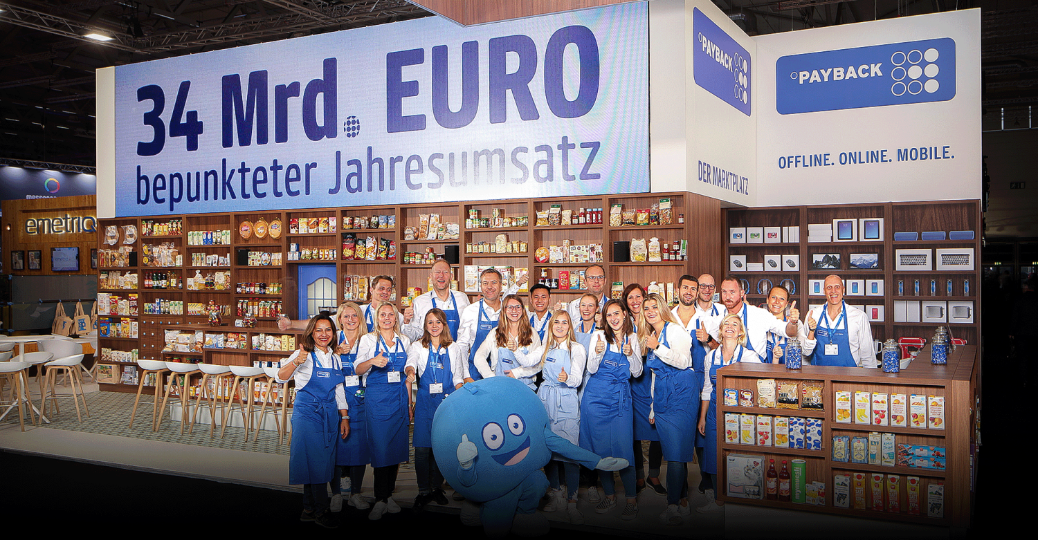 Payback stand at a trade fair in the style of a corner store