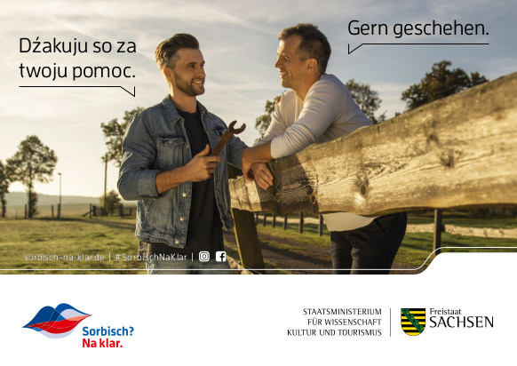 Kampagnenbanner von "Sorbisch? Na klar" mit zwei Männern, die miteinander reden - einer auf Deutsch, einer auf Sorbisch